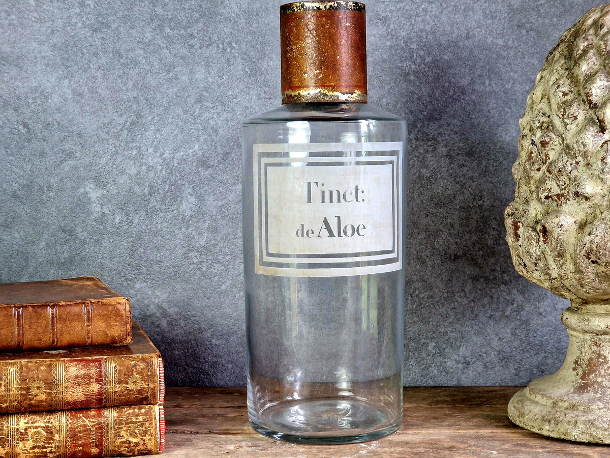 French antique apothecary bottle. Antique pharmacy bottle "Tinct de Aloe" with toleware lid.