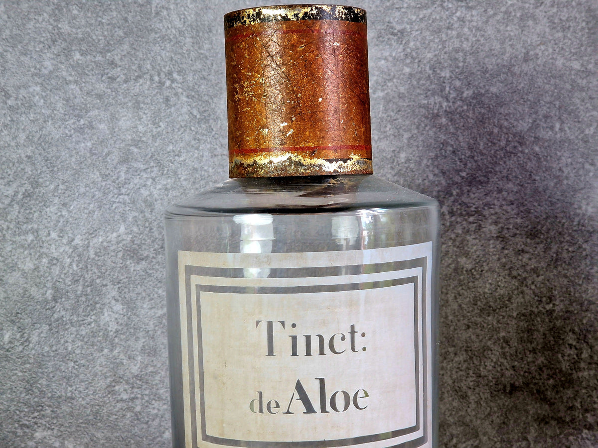 French antique apothecary bottle. Antique pharmacy bottle "Tinct de Aloe" with toleware lid.