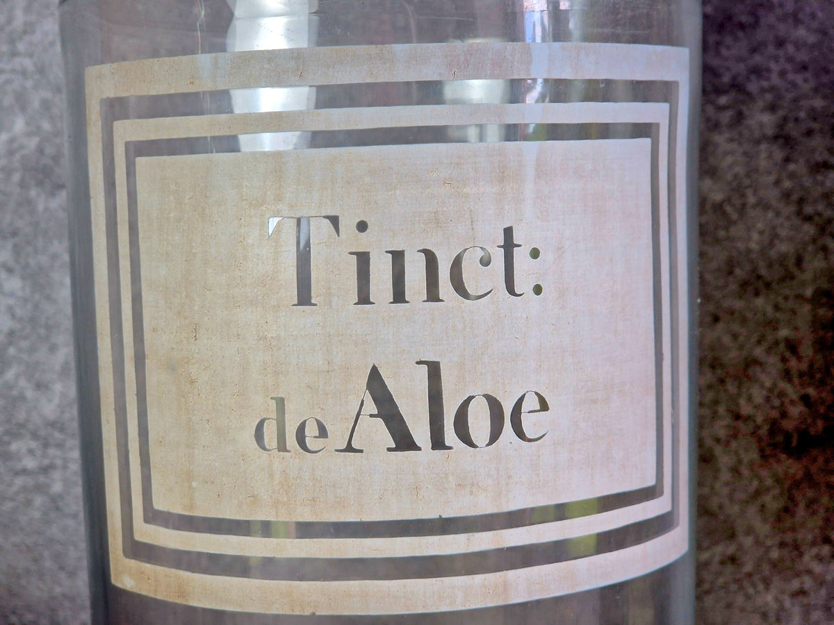 French antique apothecary bottle. Antique pharmacy bottle "Tinct de Aloe" with toleware lid.