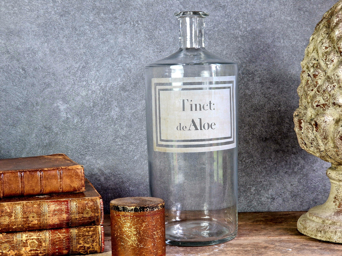 French antique apothecary bottle. Antique pharmacy bottle "Tinct de Aloe" with toleware lid.