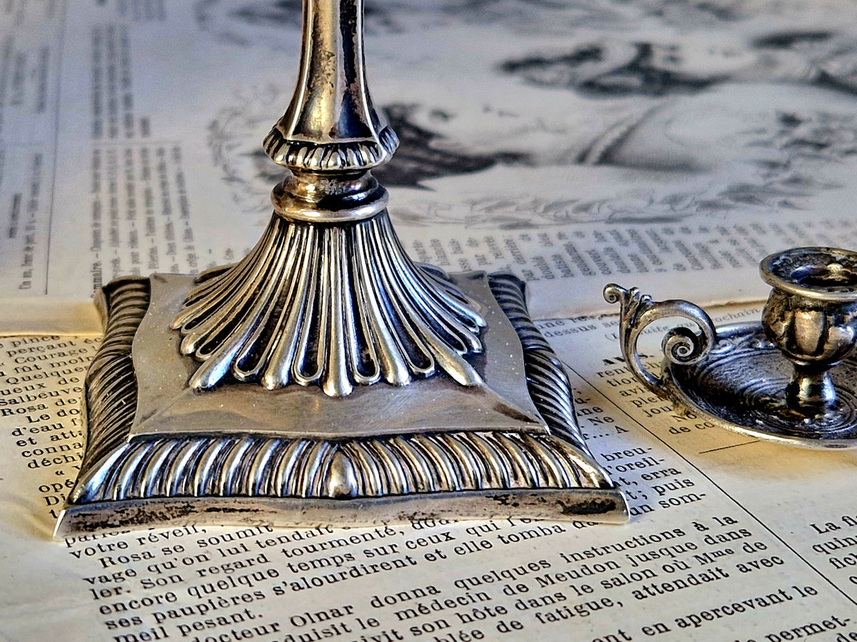 Antique silver taperstick by Thomas Bradbury and sons London 1902 and a small taper chamberstick.
