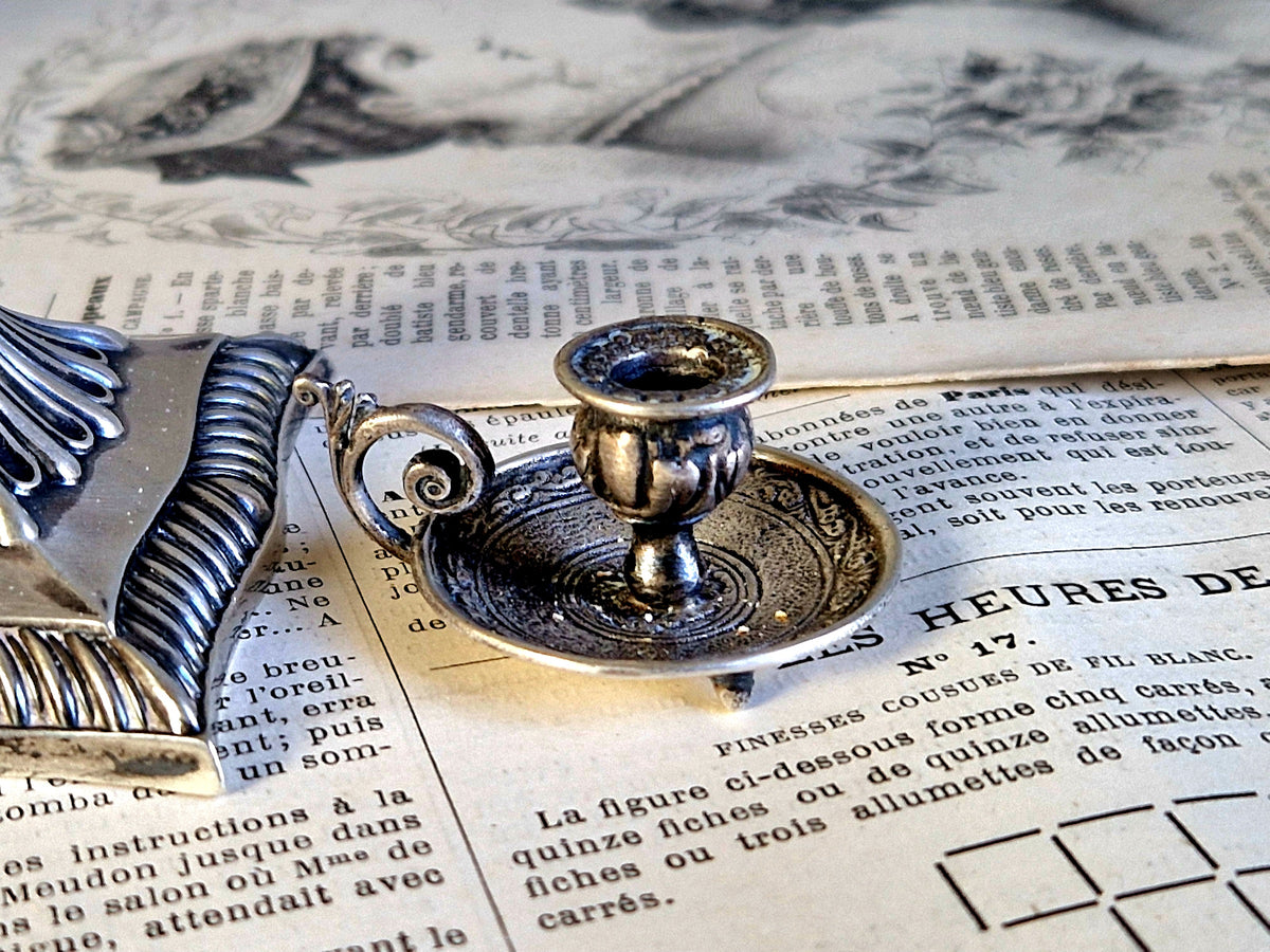Antique silver taperstick by Thomas Bradbury and sons London 1902 and a small taper chamberstick.