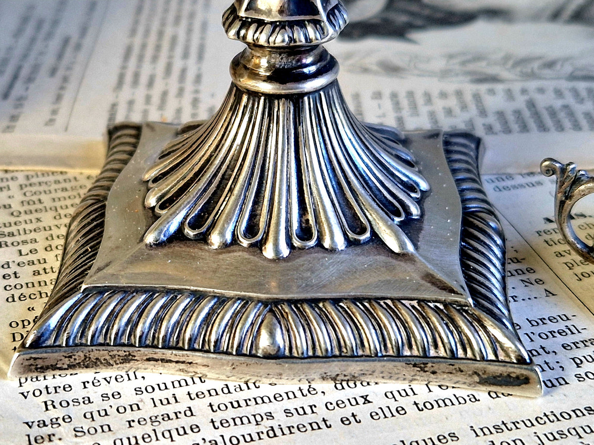 Antique silver taperstick by Thomas Bradbury and sons London 1902 and a small taper chamberstick.