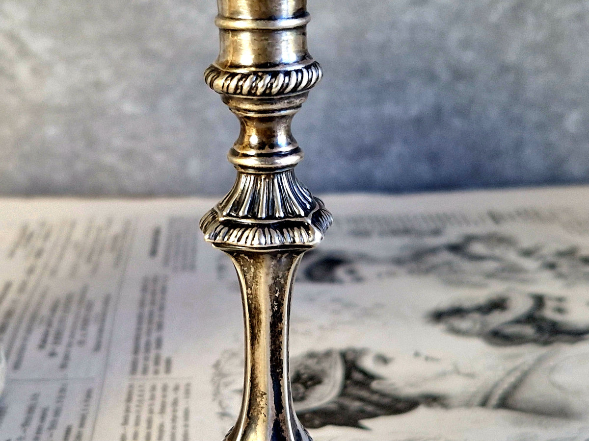 Antique silver taperstick by Thomas Bradbury and sons London 1902 and a small taper chamberstick.