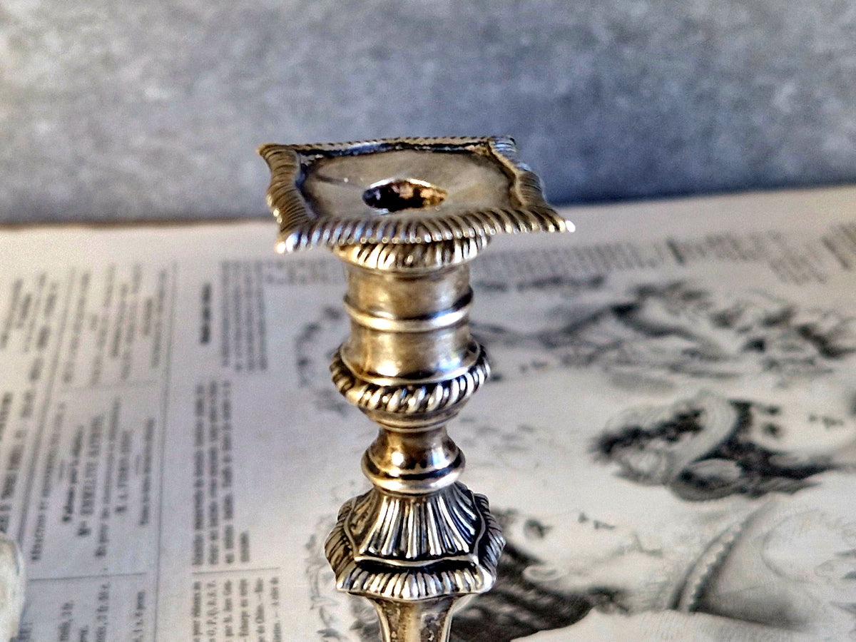 Antique silver taperstick by Thomas Bradbury and sons London 1902 and a small taper chamberstick.