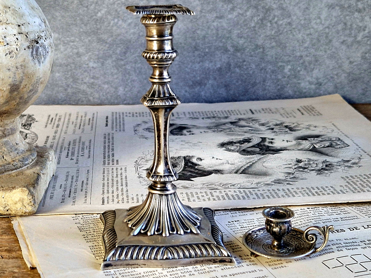 Antique silver taperstick by Thomas Bradbury and sons London 1902 and a small taper chamberstick.