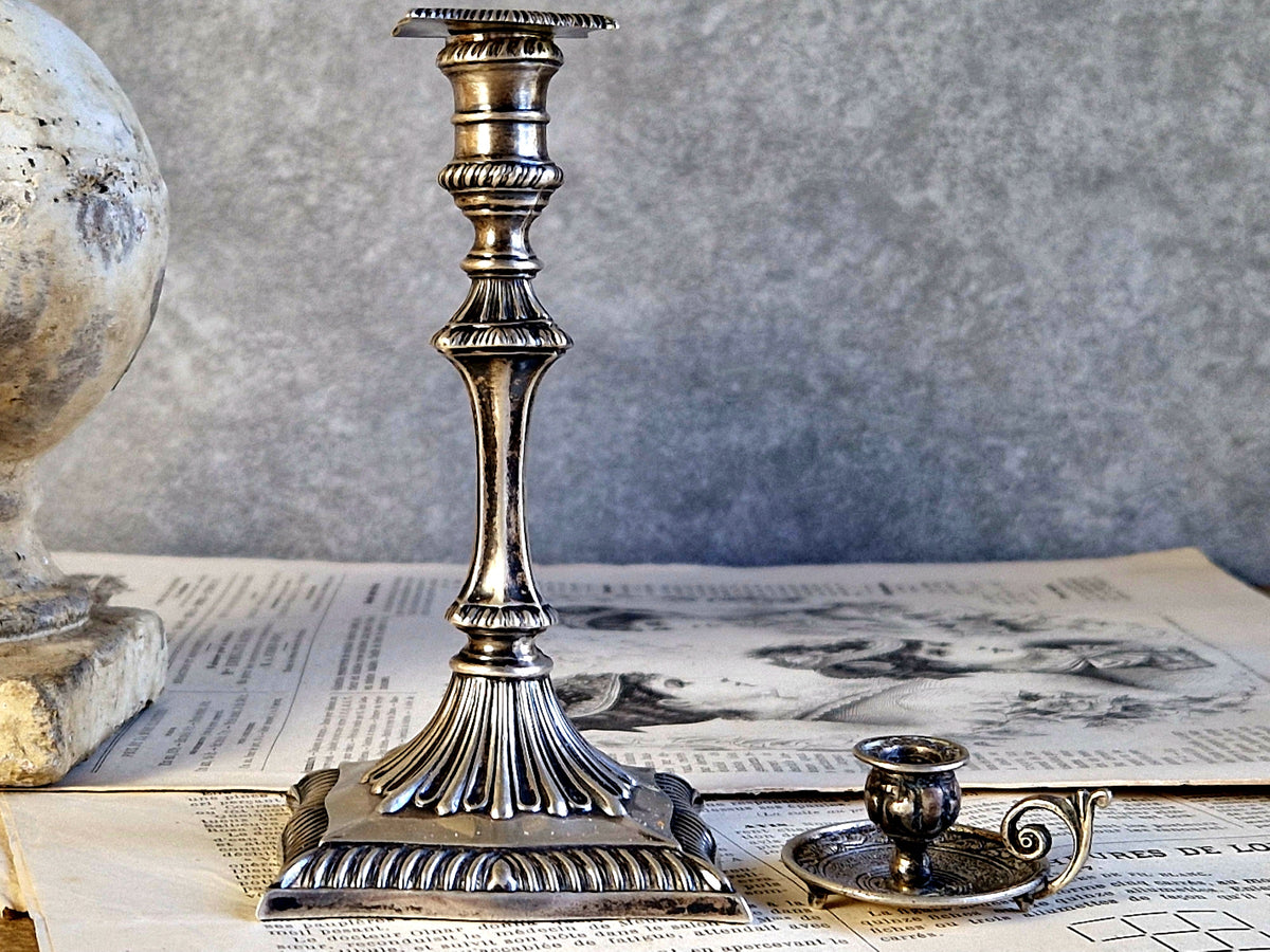 Antique silver taperstick by Thomas Bradbury and sons London 1902 and a small taper chamberstick.