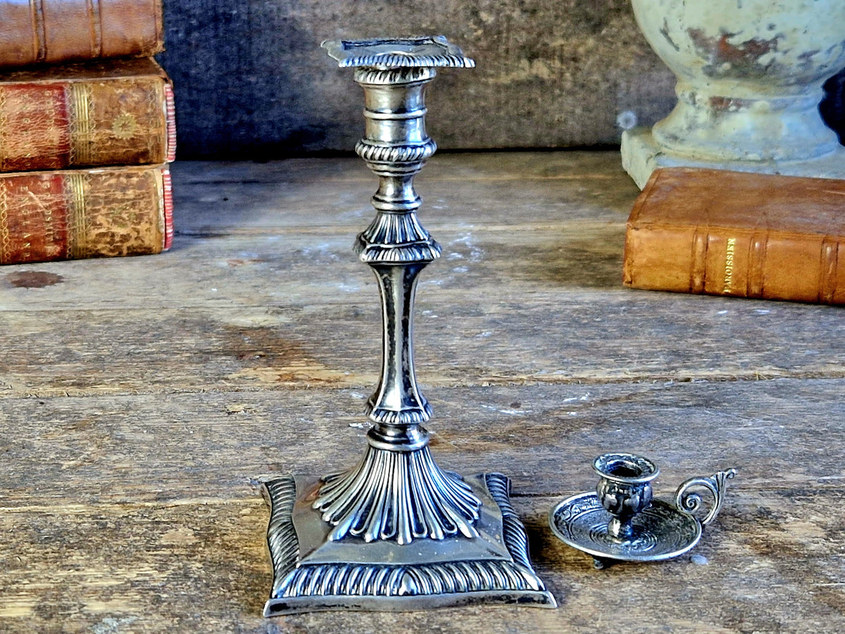 Antique silver taperstick by Thomas Bradbury and sons London 1902 and a small taper chamberstick.