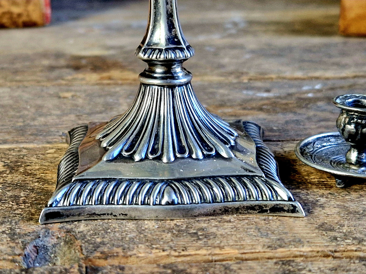Antique silver taperstick by Thomas Bradbury and sons London 1902 and a small taper chamberstick.