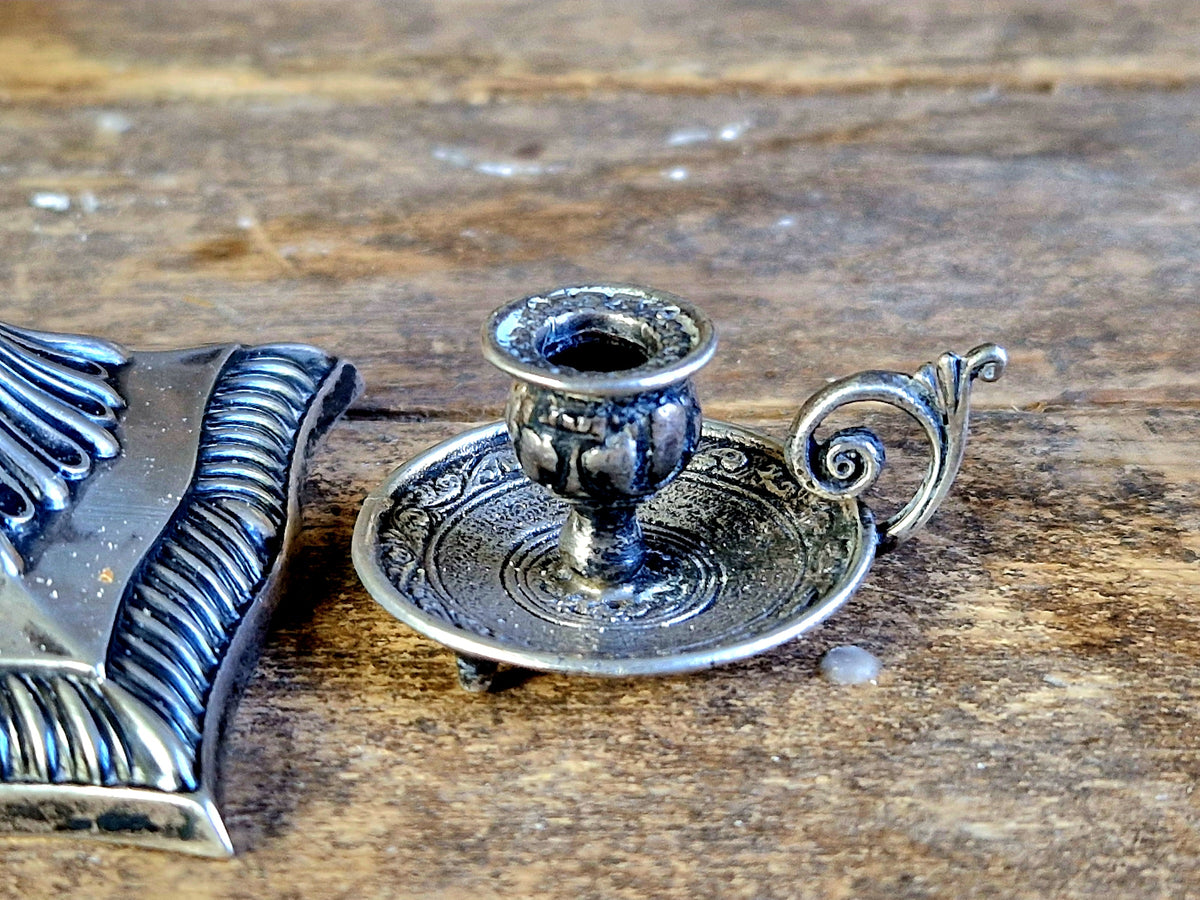 Antique silver taperstick by Thomas Bradbury and sons London 1902 and a small taper chamberstick.