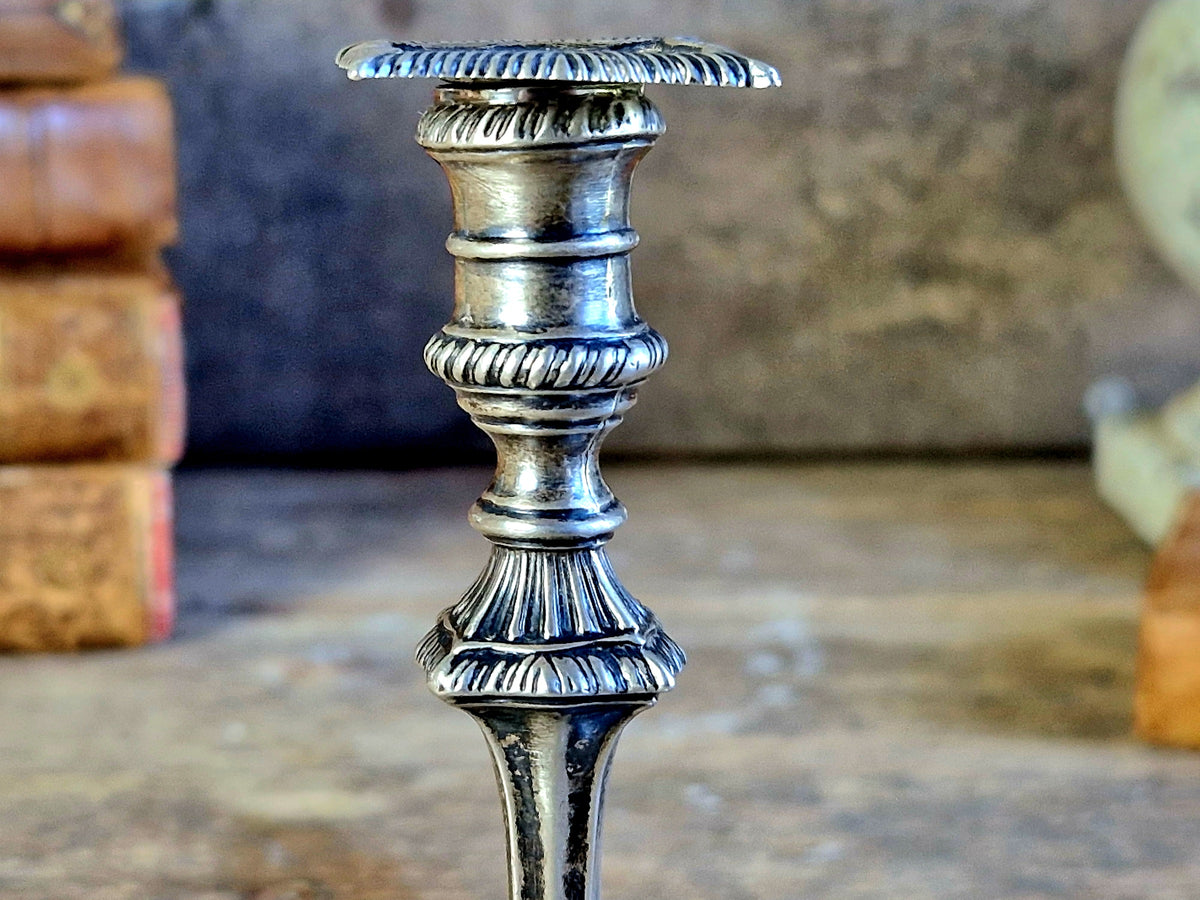 Antique silver taperstick by Thomas Bradbury and sons London 1902 and a small taper chamberstick.