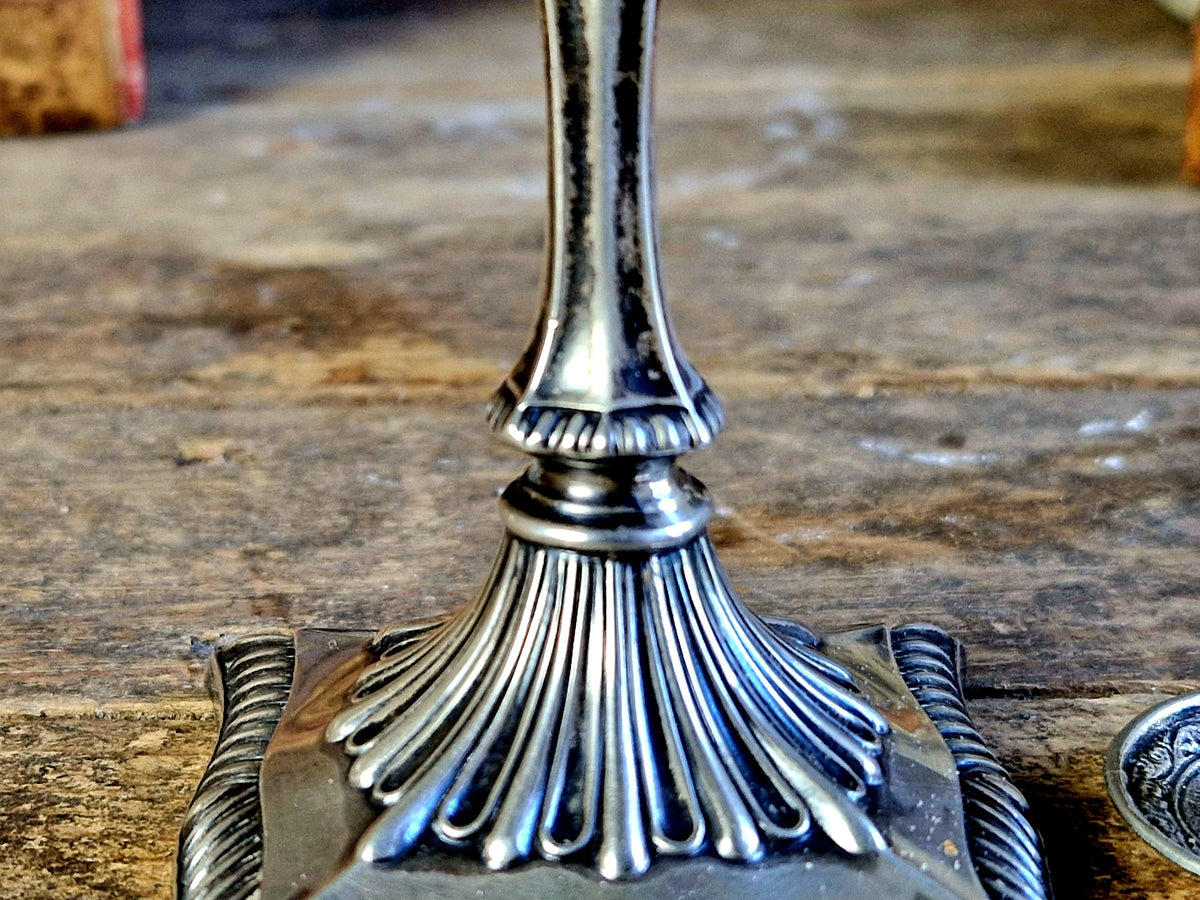 Antique silver taperstick by Thomas Bradbury and sons London 1902 and a small taper chamberstick.