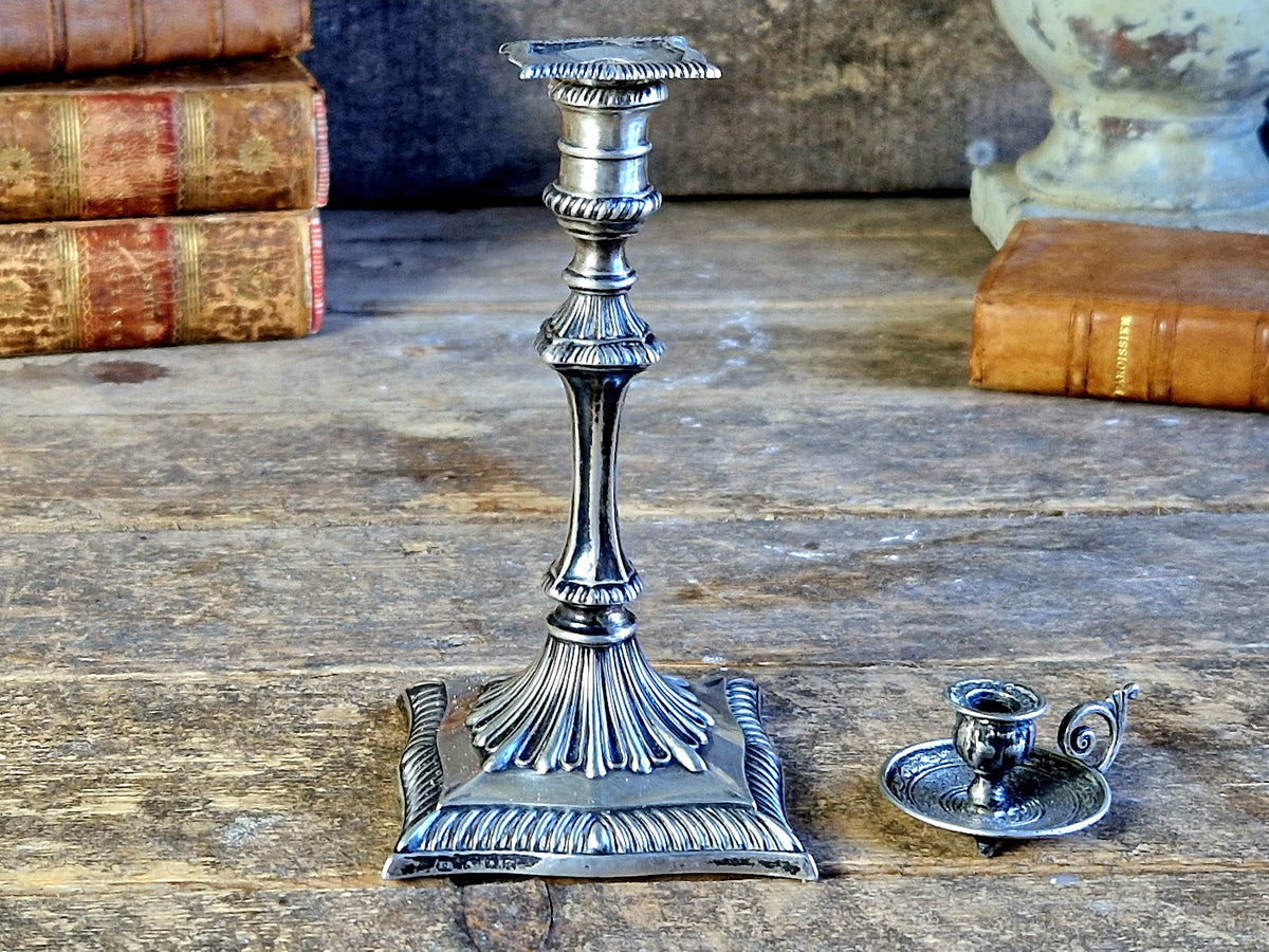 Antique silver taperstick by Thomas Bradbury and sons London 1902 and a small taper chamberstick.