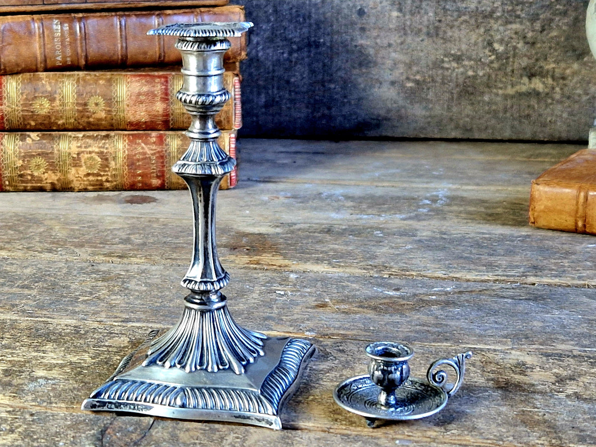 Antique silver taperstick by Thomas Bradbury and sons London 1902 and a small taper chamberstick.