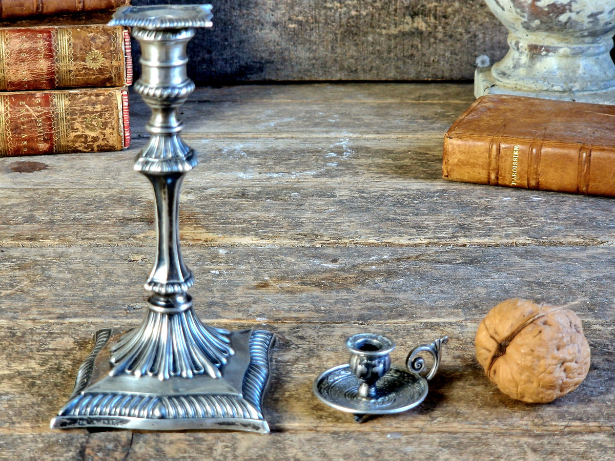 Antique silver taperstick by Thomas Bradbury and sons London 1902 and a small taper chamberstick.