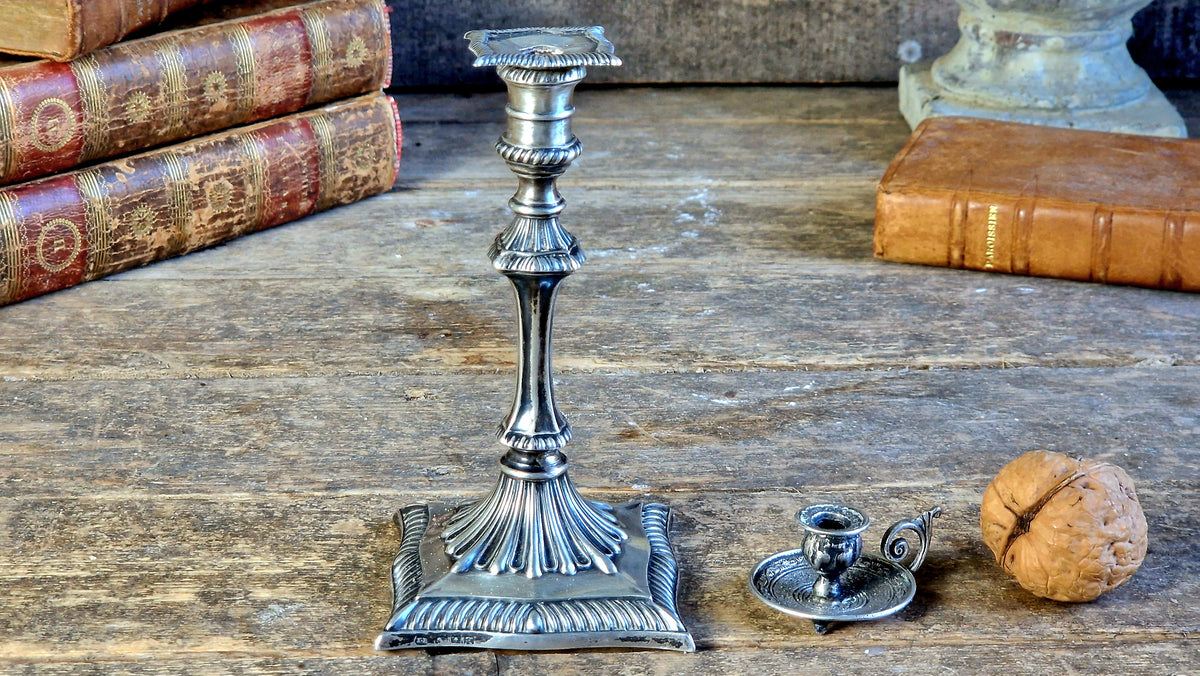 Antique silver taperstick by Thomas Bradbury and sons London 1902 and a small taper chamberstick.
