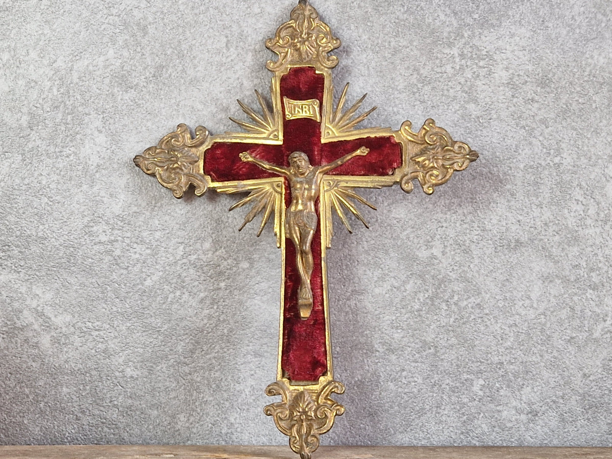 French antique crucifix with red velvet and sunburst design.