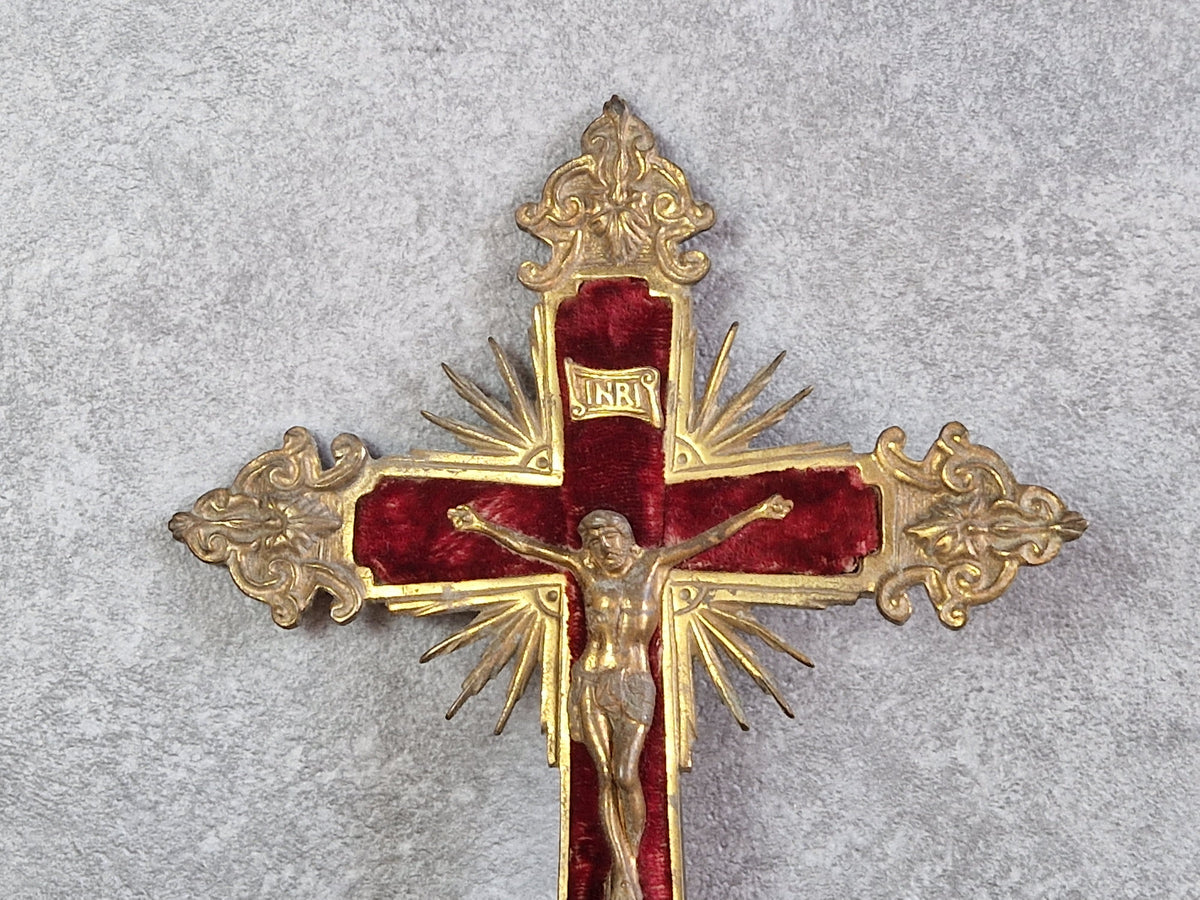 French antique crucifix with red velvet and sunburst design.
