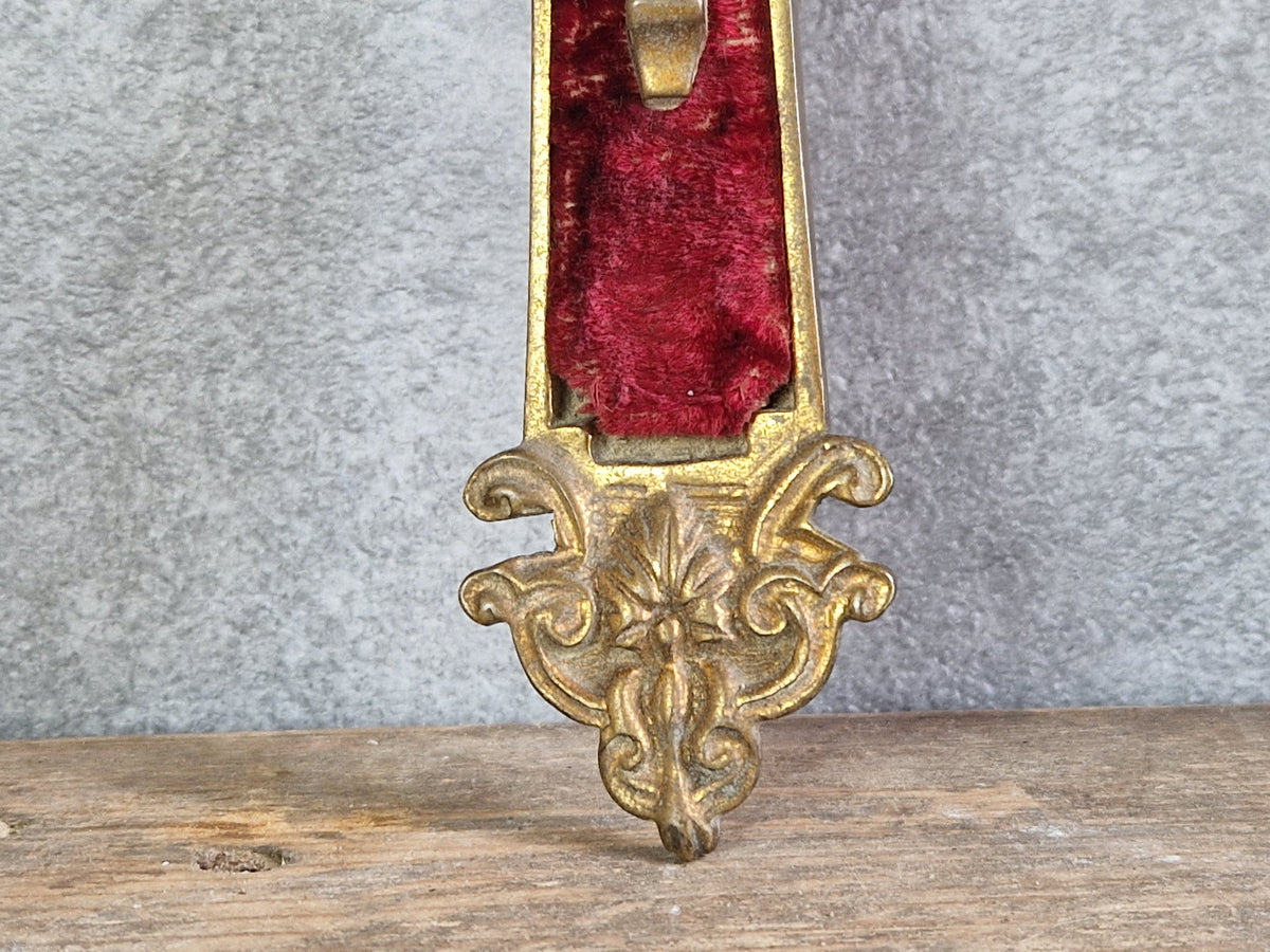 French antique crucifix with red velvet and sunburst design.