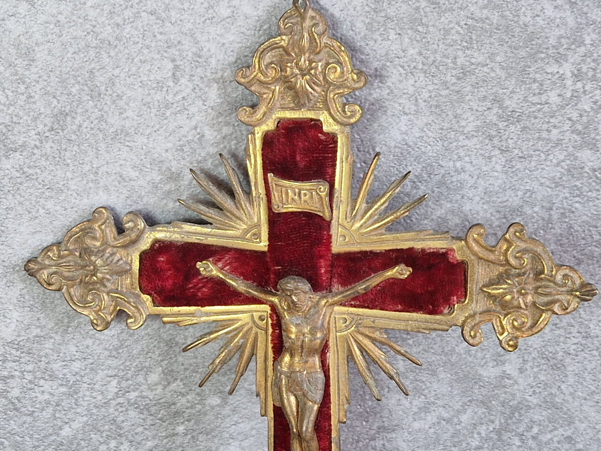 French antique crucifix with red velvet and sunburst design.