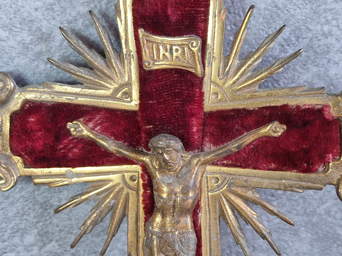 French antique crucifix with red velvet and sunburst design.