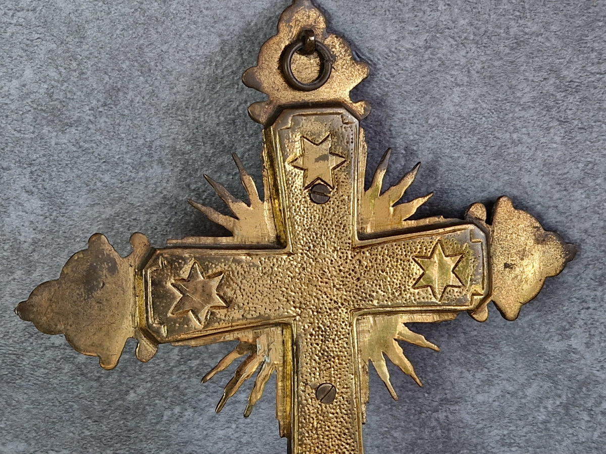 French antique crucifix with red velvet and sunburst design.