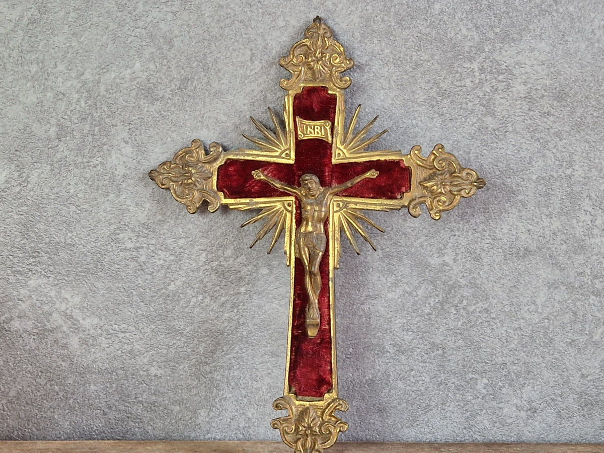 French antique crucifix with red velvet and sunburst design.