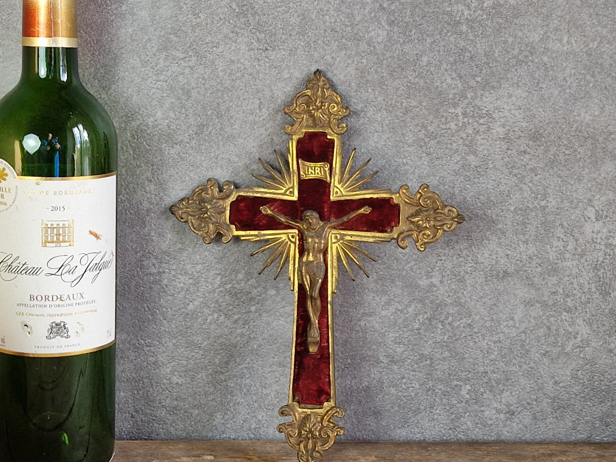 French antique crucifix with red velvet and sunburst design.