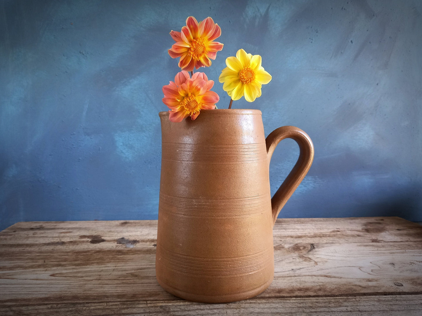 French vintage stoneware jug with yellow flowers.