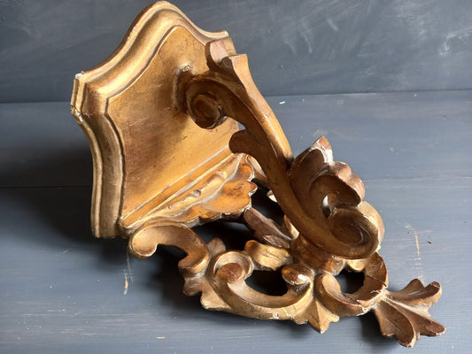 Antique gilt shelf. Ornate carved gilt shelf.