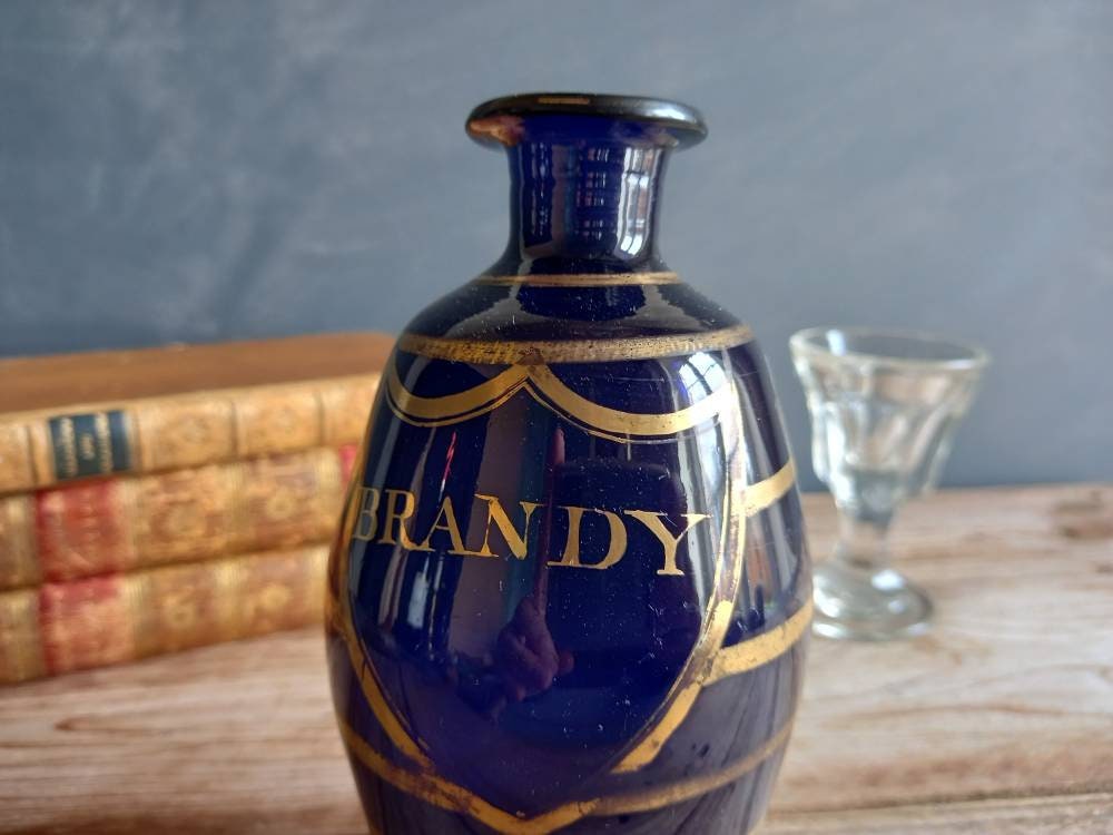 Antique blue Brandy bottle. Old blue bottle. Regency bottle. Antique decanter.