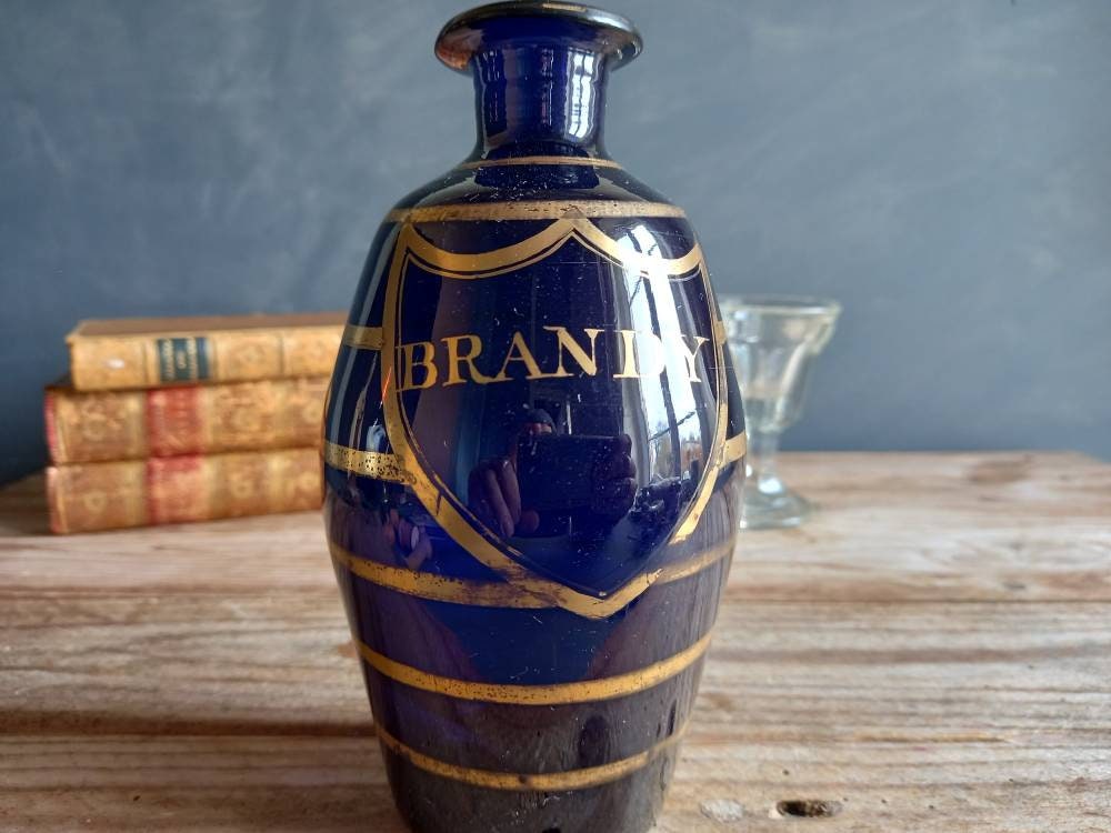 Antique blue Brandy bottle. Old blue bottle. Regency bottle. Antique decanter.
