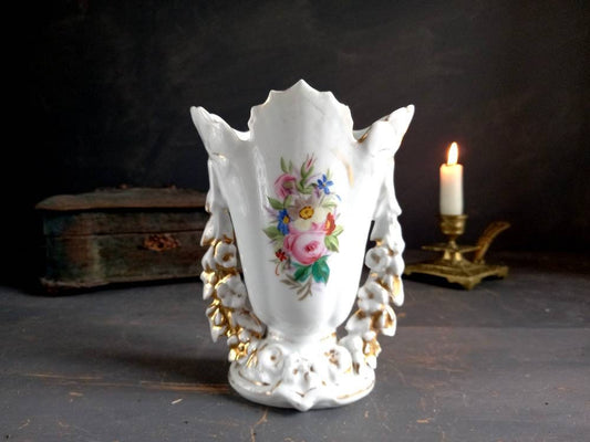 White Paris porcelain vase with floral decoration.