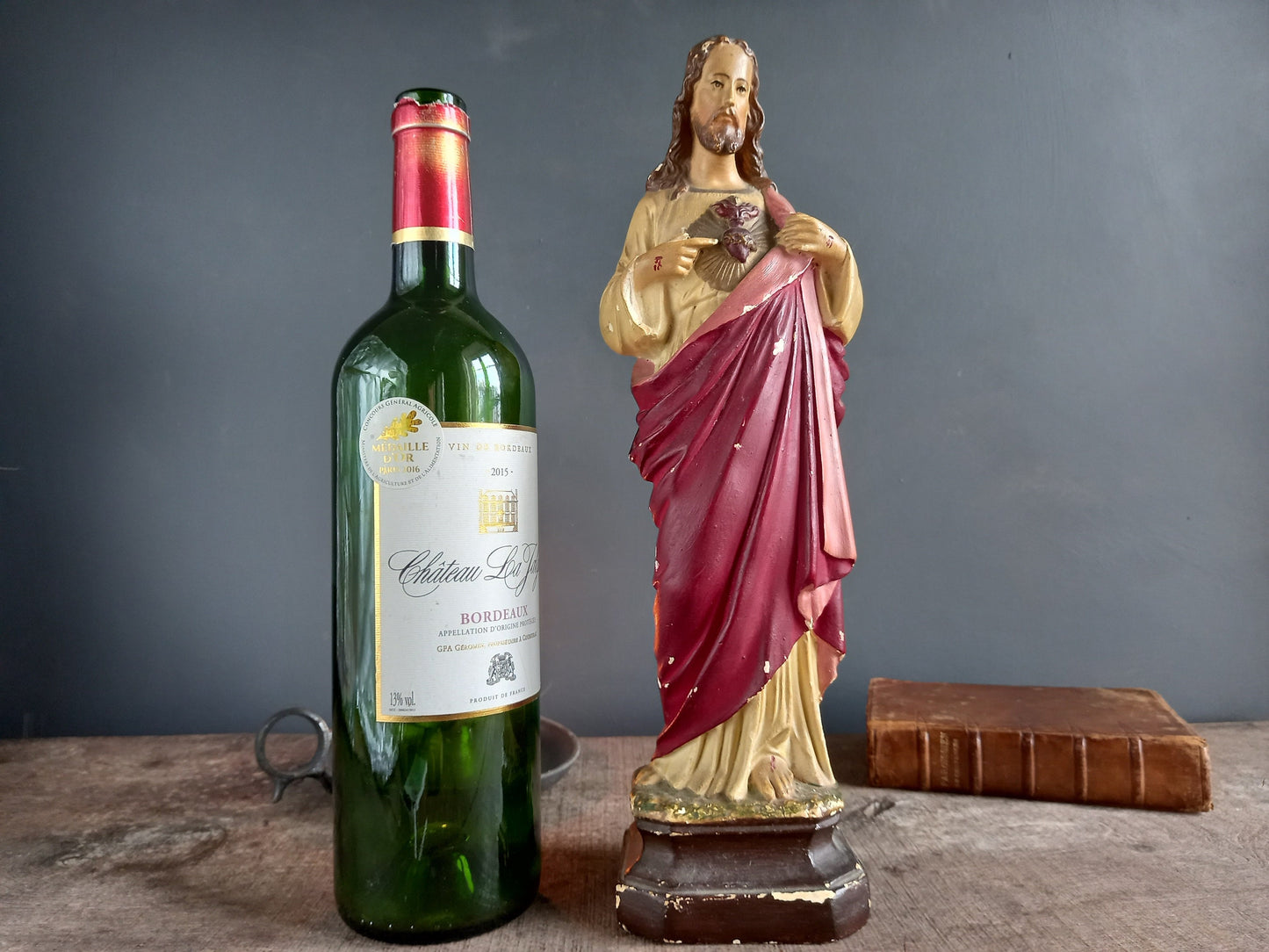 French antique Jesus statue. Religious statue.