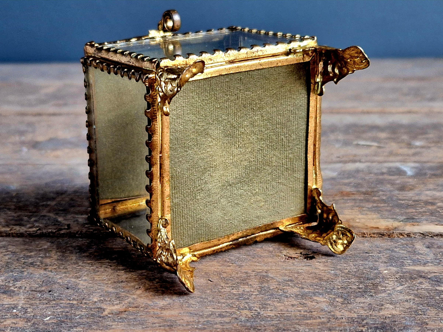 Antique French glass jewelry box with blue silk lining.