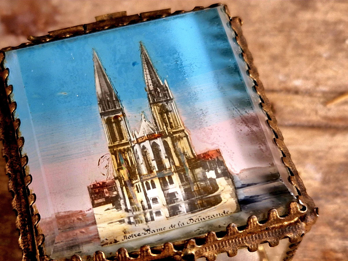 Antique French glass jewelry box with blue silk lining.