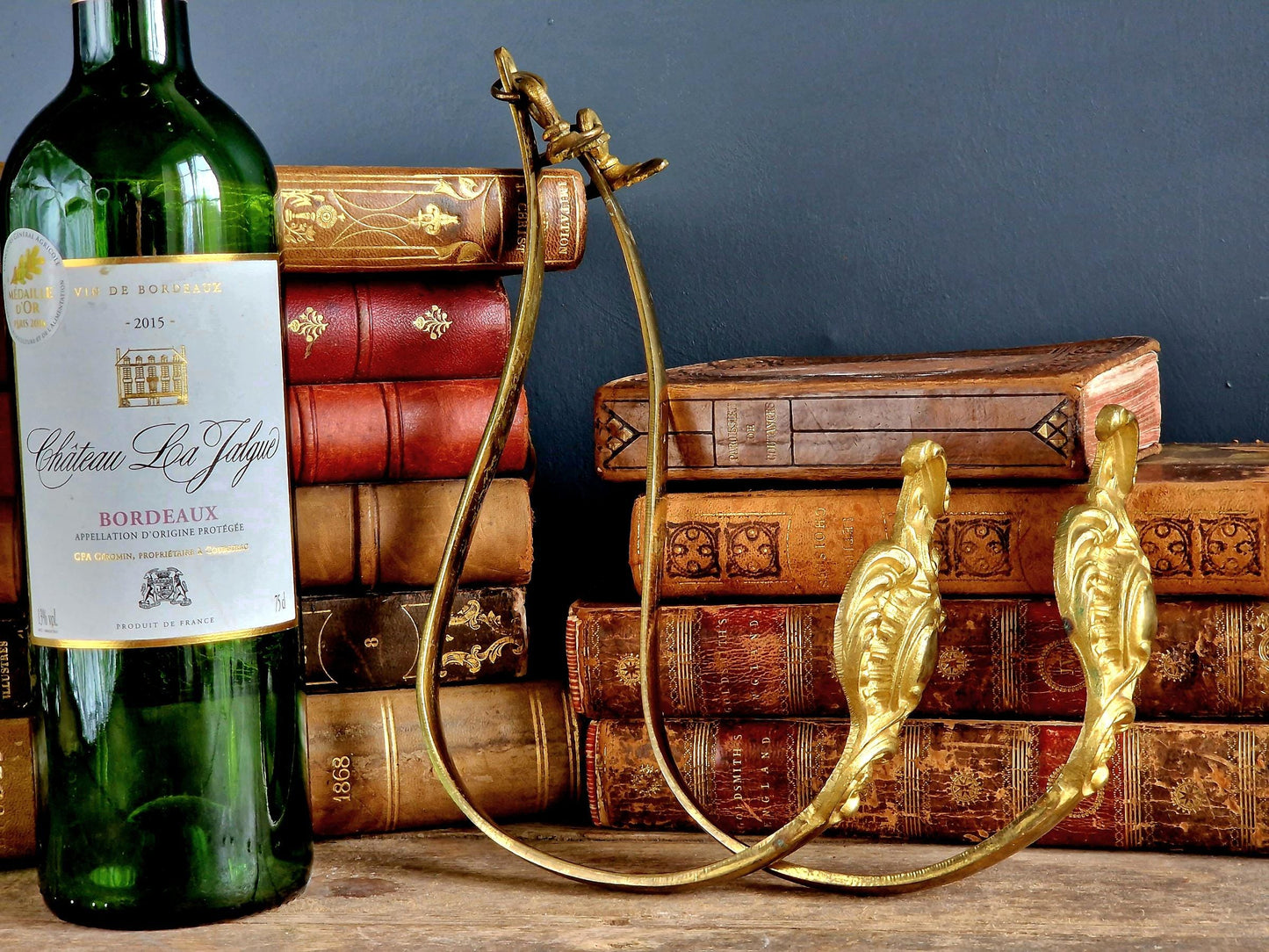 French gilt brass curtain tiebacks. Pair of French rococo style gilt brass tiebacks.