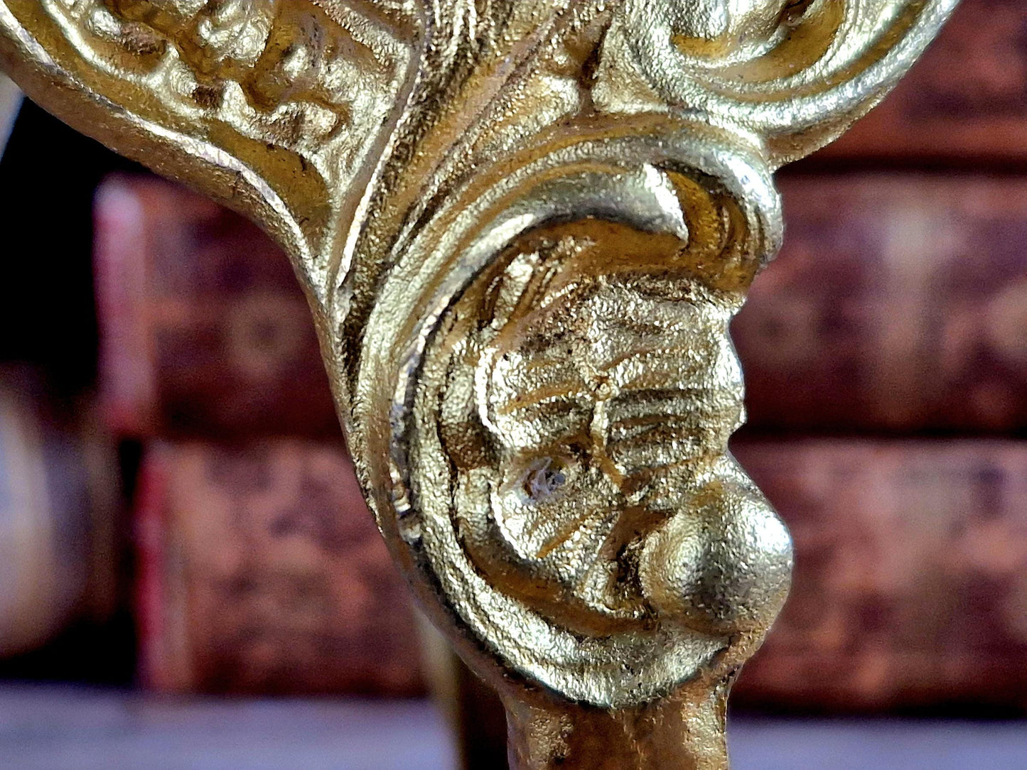 French gilt brass curtain tiebacks. Pair of French rococo style gilt brass tiebacks.