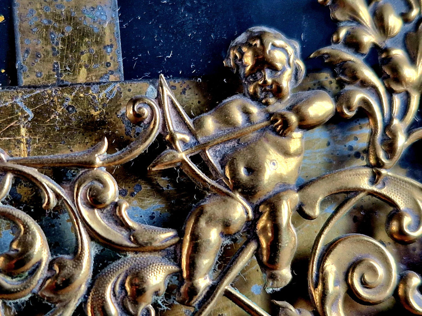 French antique glass photo frame with gilt scrolling metal base.