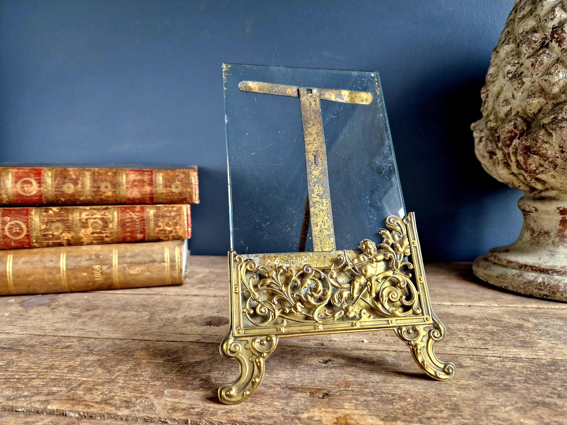 French antique glass photo frame with scrolling metal base.