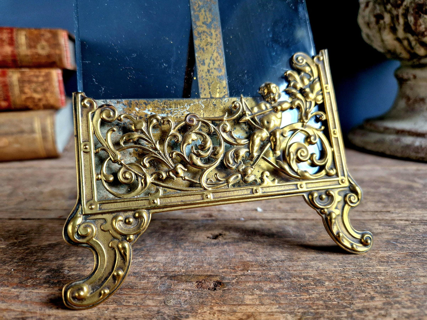 French antique glass photo frame with gilt scrolling metal base.