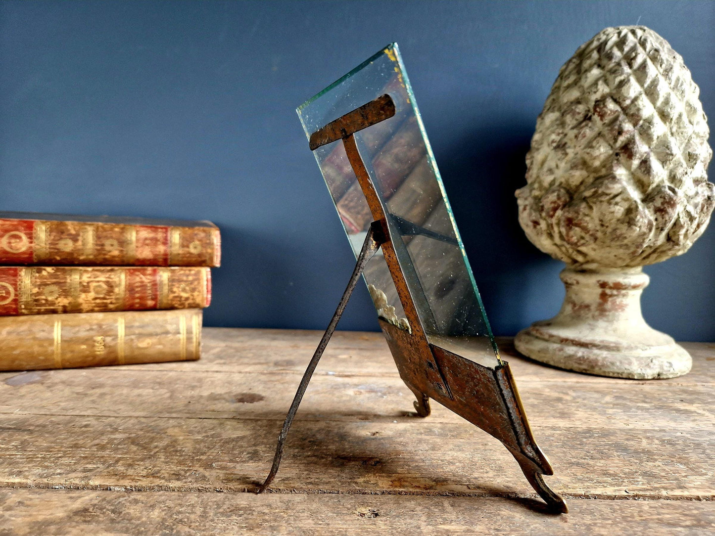 French antique glass photo frame with gilt scrolling metal base.