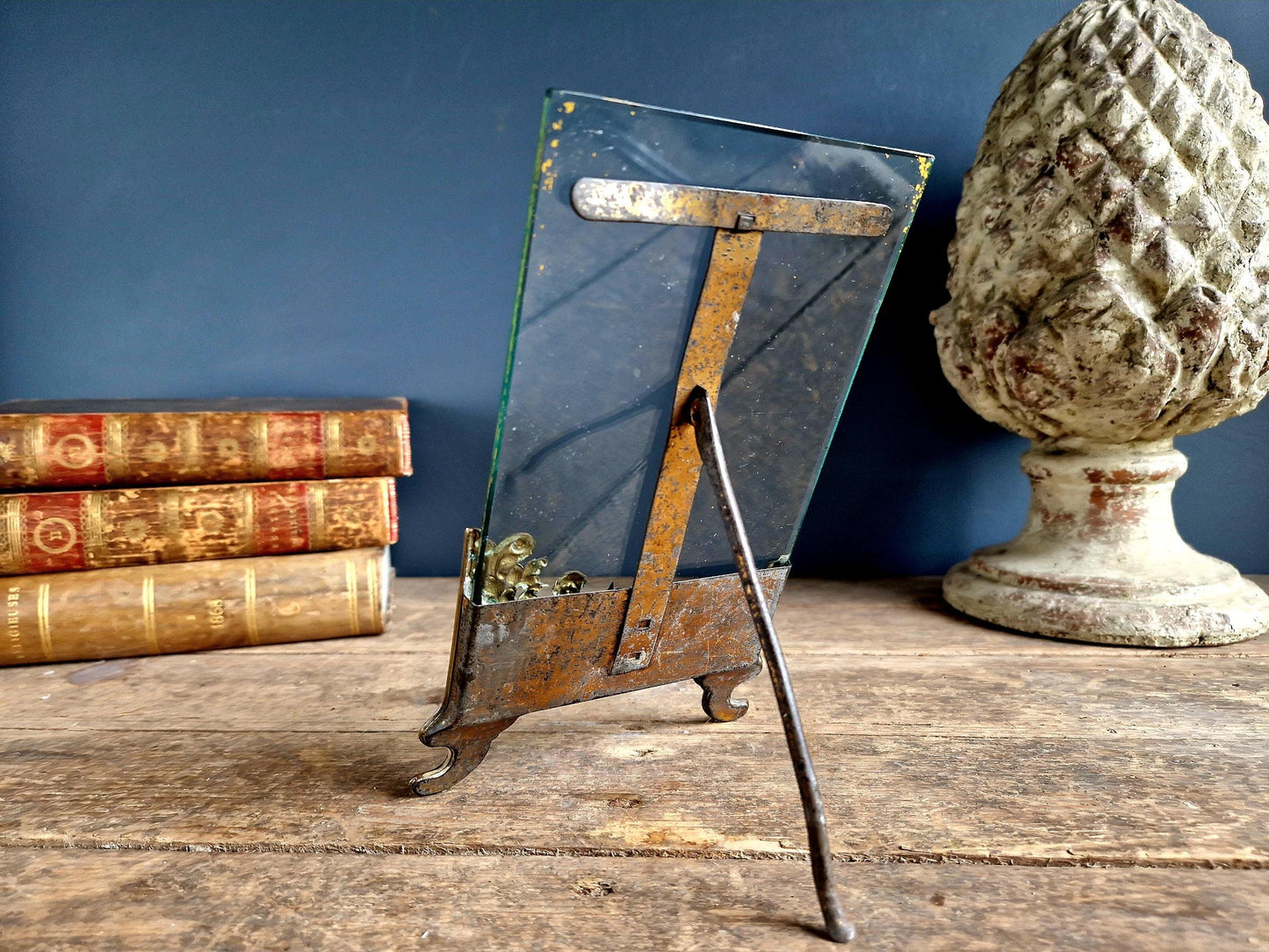 French antique glass photo frame with gilt scrolling metal base.