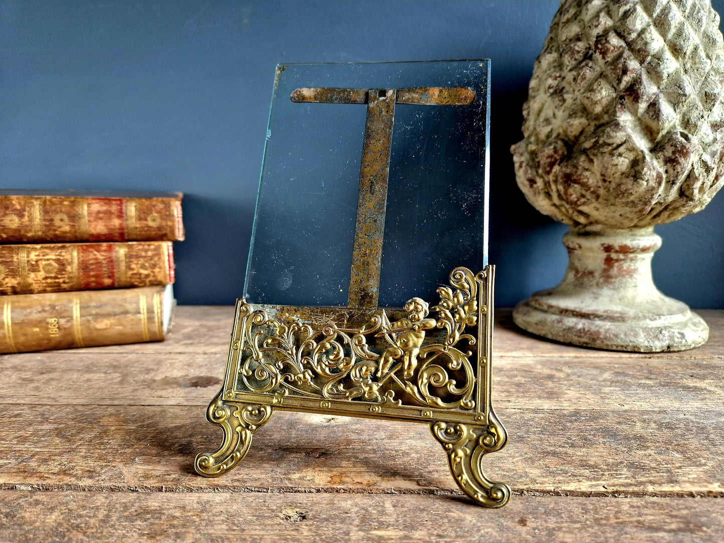 French antique glass photo frame with gilt scrolling metal base.