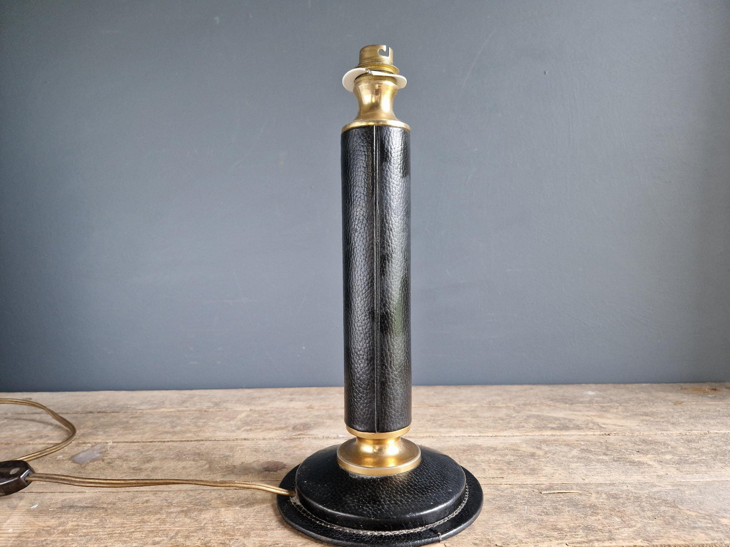 French vintage black leather lamp in the manner of Jacques Adnet Le tanneur table lamp.