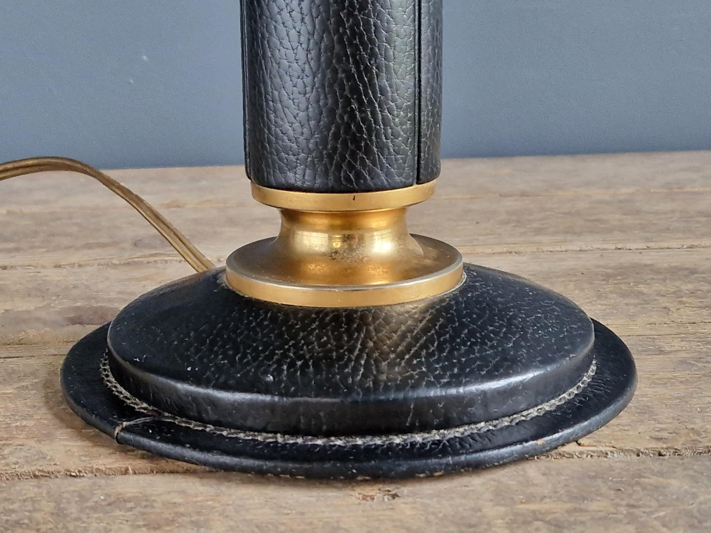 French vintage black leather lamp in the manner of Jacques Adnet Le tanneur table lamp.