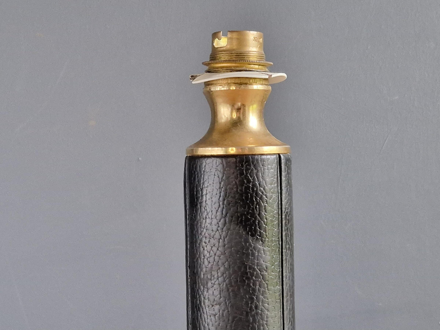 French vintage black leather lamp in the manner of Jacques Adnet Le tanneur table lamp.