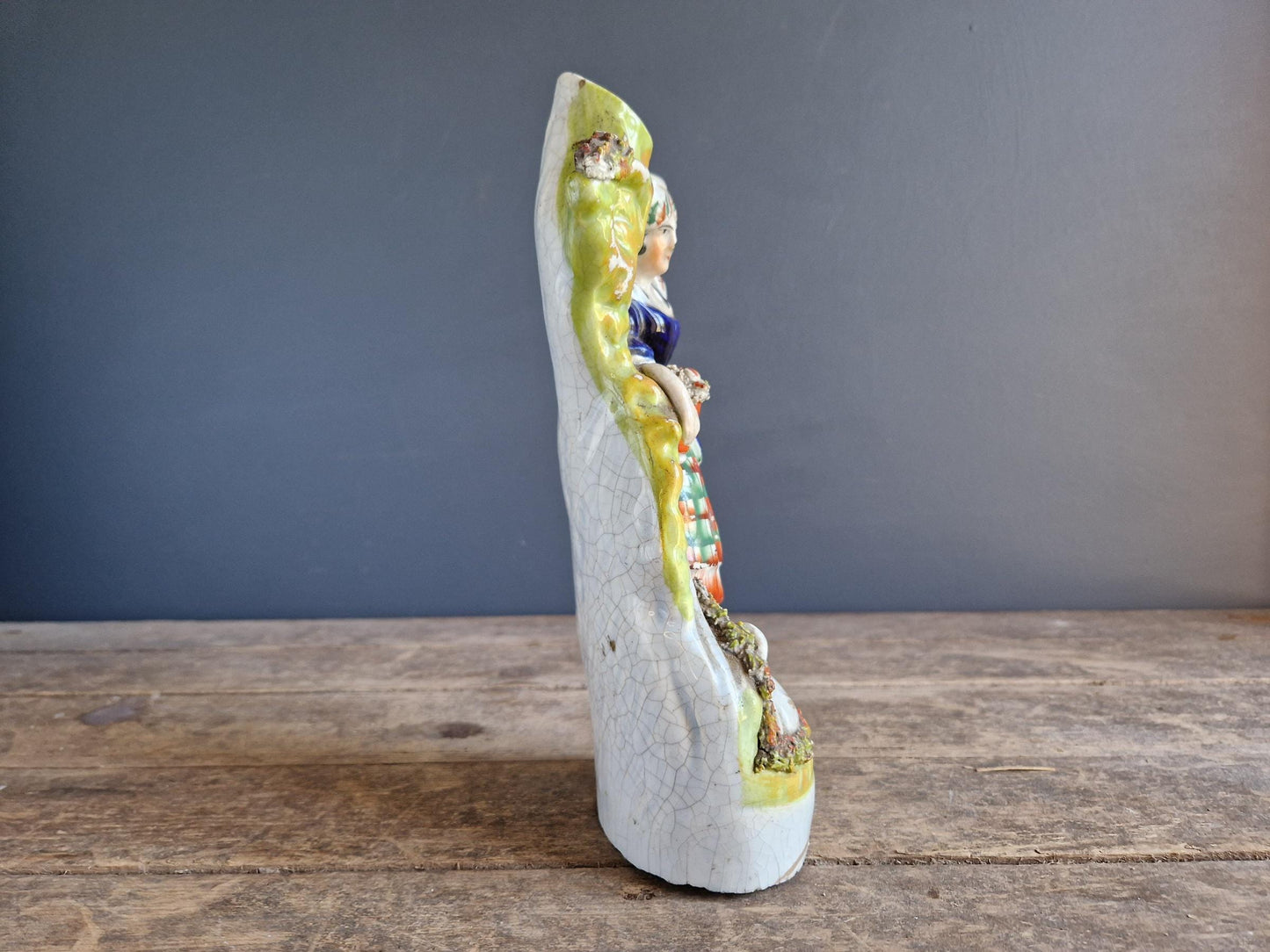 Antique Staffordshire flatback statue of a girl with a swan.