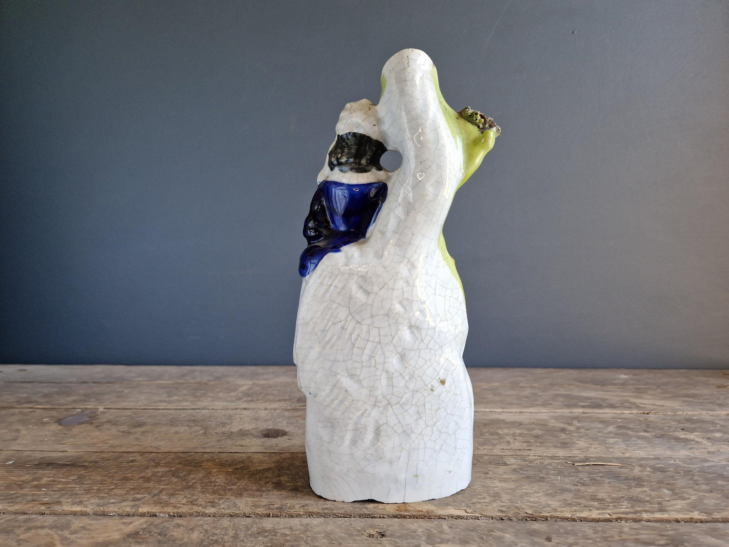 Antique Staffordshire flatback statue of a girl with a swan.