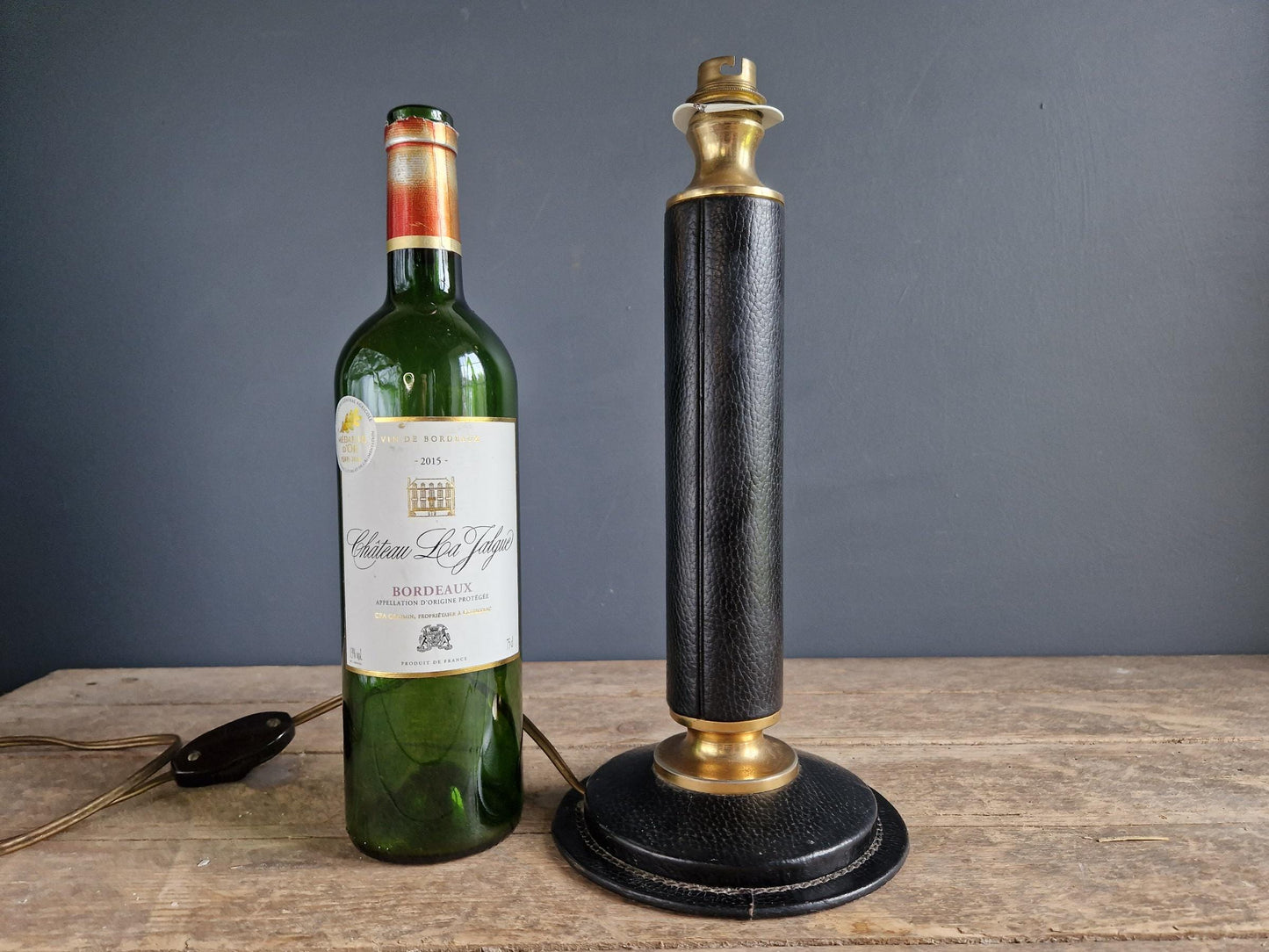 French vintage black leather lamp in the manner of Jacques Adnet Le tanneur table lamp.